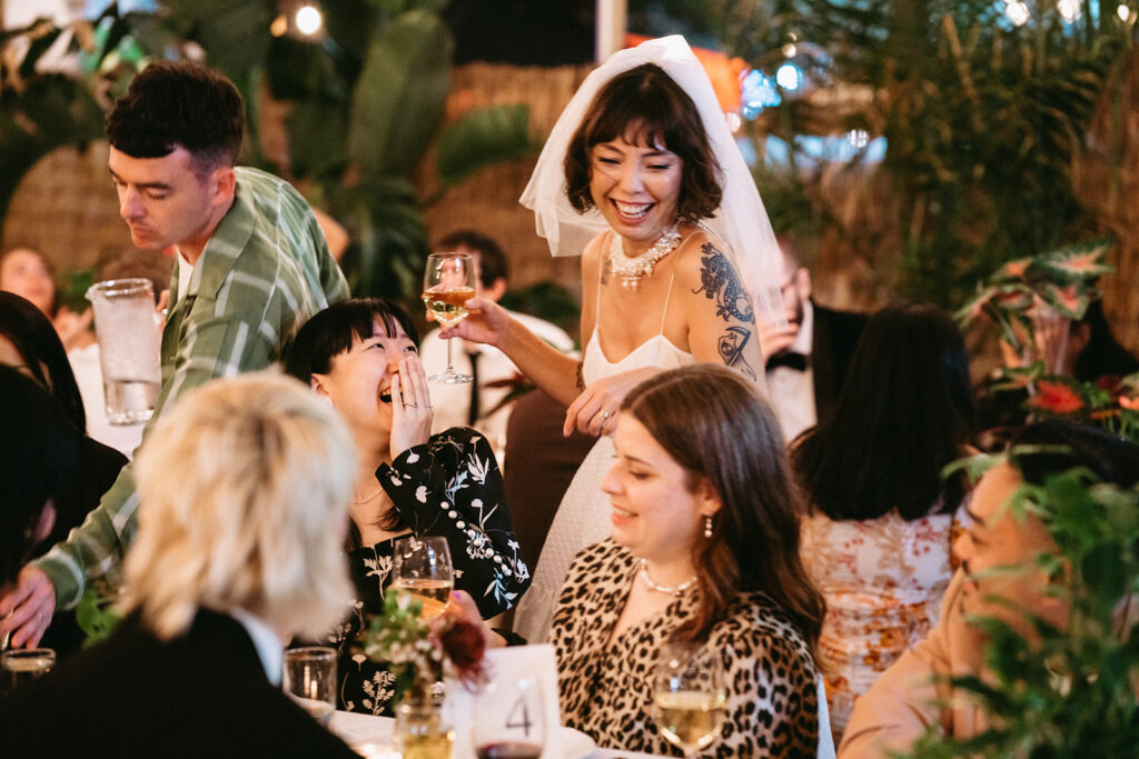 bride talking to guests during reception | Top 20 Unique Brooklyn Wedding Venues